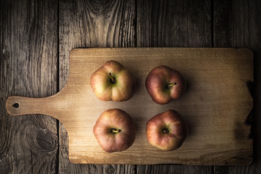 Red apples on a cutting board horizontal