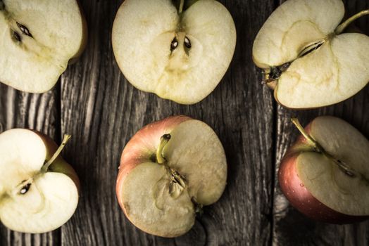 Apple halves on a wooden table horizontal