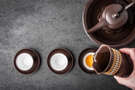 Kettle for tea ceremony on a gray  stone table horizontal