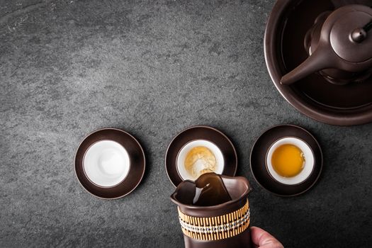 Kettle for tea ceremony on a gray stone table horizontal