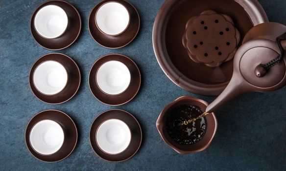 Kettle for tea ceremony on a blue stone table horizontal, super still life