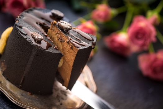 Coffee mousse and a bouquet of roses on a blue table horizontal