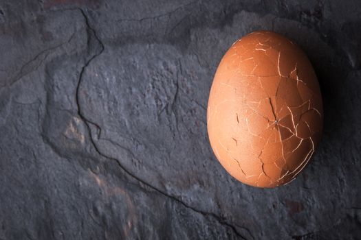 Chicken eggs in the cracks in the stone table horizontal