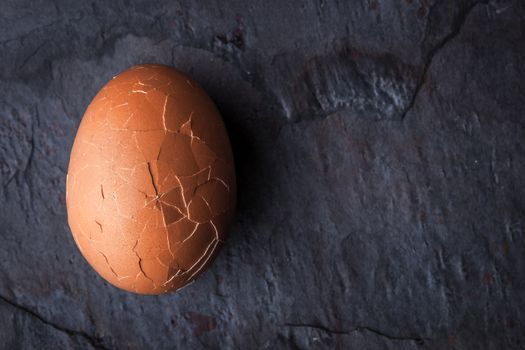 Chicken eggs in the cracks in the stone table horizontal