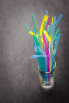 Sticks for a cocktail in a transparent glass horizontal