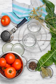 Tomato,spices and cooking utensils for pickling vegetables