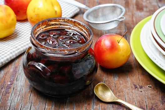 Glass jar with jam from the harvest of autumn plums