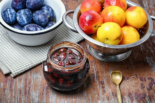 Glass jar with jam from the harvest of autumn plums