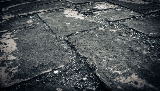 Weathered texture of stained old dark brick wall background