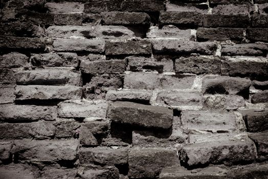 Weathered texture of stained old dark  brick wall background