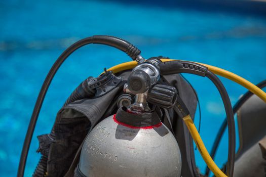 Diving equipment in front of water detailed view