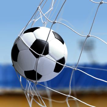 soccer ball is in goal net during a match