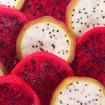 Fresh sliced red and white dragon fruit