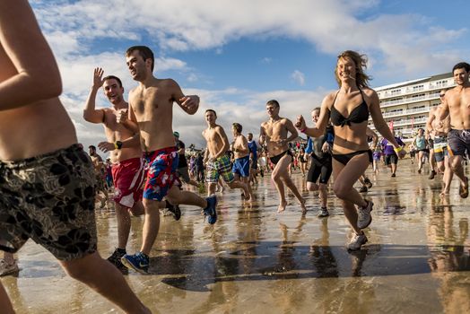 OLD ORCHARD BEACH - JANUARY 1 2016: several hundred people took part in the annual Lobster Dip Plunging on January 1, 2016 in Old Orchard Beach, Maine USA