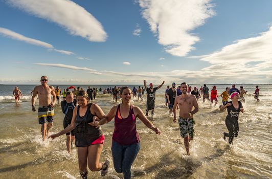 OLD ORCHARD BEACH - JANUARY 1 2016: several hundred people took part in the annual Lobster Dip Plunging on January 1, 2016 in Old Orchard Beach, Maine USA