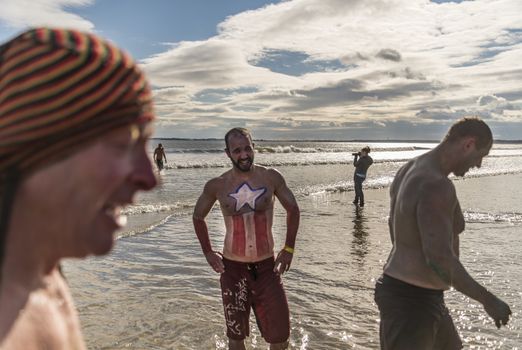 OLD ORCHARD BEACH - JANUARY 1 2016: several hundred people took part in the annual Lobster Dip Plunging on January 1, 2016 in Old Orchard Beach, Maine USA