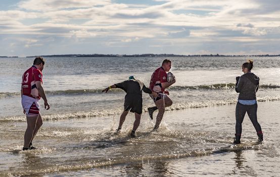 OLD ORCHARD BEACH - JANUARY 1 2016: several hundred people took part in the annual Lobster Dip Plunging on January 1, 2016 in Old Orchard Beach, Maine USA