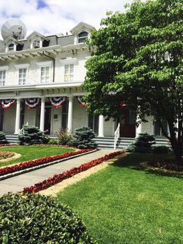 House with American flags and designer garden