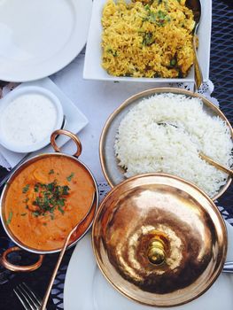 Curry meal displayed on a table, outdoors