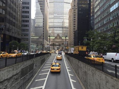 New York City view of Grand central station and yellow cabs.