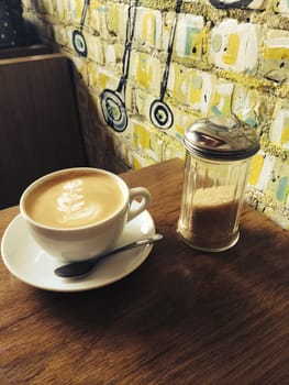 Large coffee, indoors in cafe