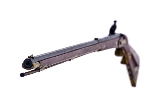 Black powder flint lock rifle with the focus on the muzzle end of the gun