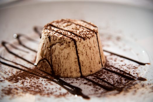 Semifreddo with walnut and chocolate sause in a restaurant.