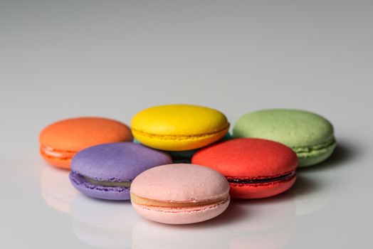 Image of assorted colors of macaroons on a neutral background