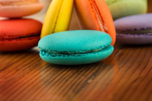 arrangement of colorful macaroons on vintage table