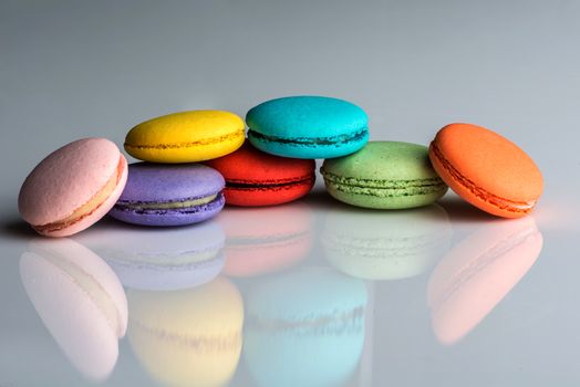 Assorted colors of macaroons on neutral background