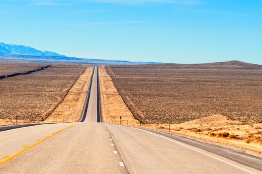 Long straight strech of US highway 287 through ranch country in central Wyoming, USA.