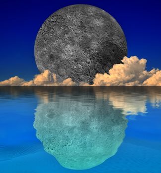 Far side of the moon reflected against a still sea in a fantasy image. Moon image supplied by NASA