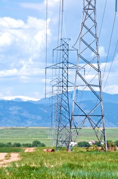 High Voltage towers from the prairie to the mountains.