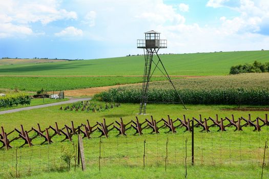 View on watchtower and line of defense and military territory near state border. Memorial military area near Satov village in Czech Republic.