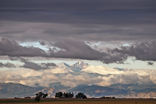 Rocky mountains in centrtal Colorado with fresh early snow and morning sunlight.