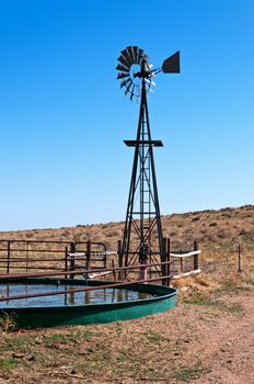 Windmill and tank on the Pawnee National Grasslands to provide drinking water for livestock. 