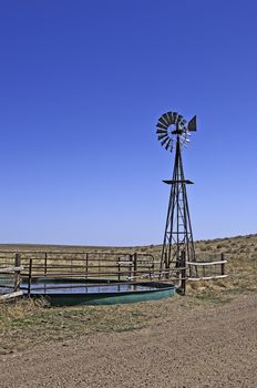 Livestock well and windmill pump on the Pawnee National Grasslands in north central Colorado, USA.