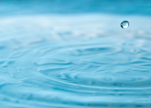 A single drop is suspended in air after a water drip