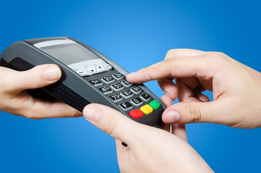 Hand with credit card swipe through terminal for sale