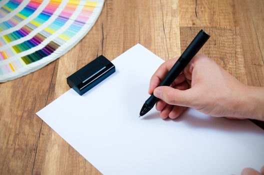 Graphic designer working with modern digitized pen