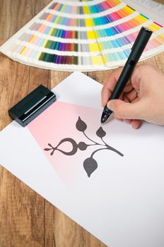 Graphic designer working with modern digitized pen