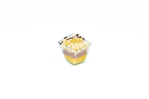 In the picture a cupcake with white choccolate,cream and custard in a plastic cup, isolated on white background.