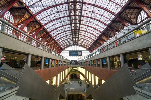 Antwerp, Belgium - May 11, 2015: People in Main hall of Antwerp Central station on May 11, 2015 in Antwerp, Belgium. The station is now widely regarded as the finest example of railway architecture in Belgium.