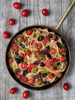 close up of rustic italian spaghetti puttanesca pasta