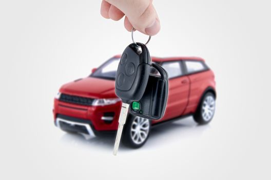 Hand holding keys to new car. Buy or selling business composition