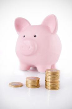Piggybank and coins savings concept