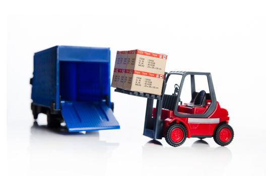 Forklift truck toys with boxes. Concept of international freight transport