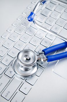 Diagnosis and repair of computers. Stethoscope on laptop