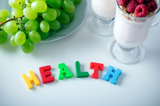 Health word made up of letters with magnets. Composition of healthy food