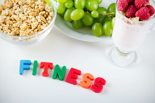 Fitness word made up of letters with magnets. Composition of healthy food